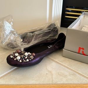 Report purple flags with sparkly detailing and embellishments